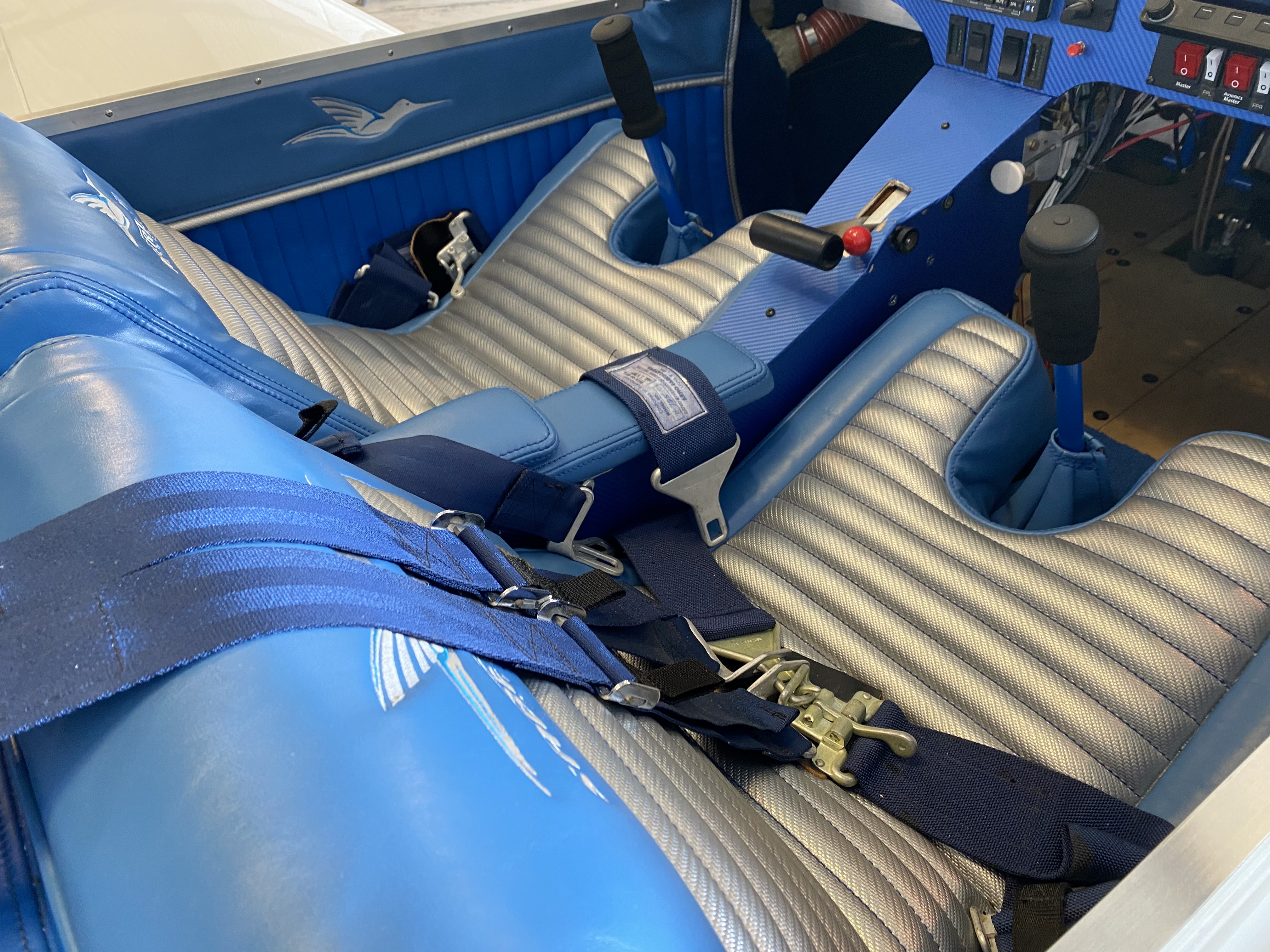 Blue and gray saberwing interior with center console saberwing logo on side panels